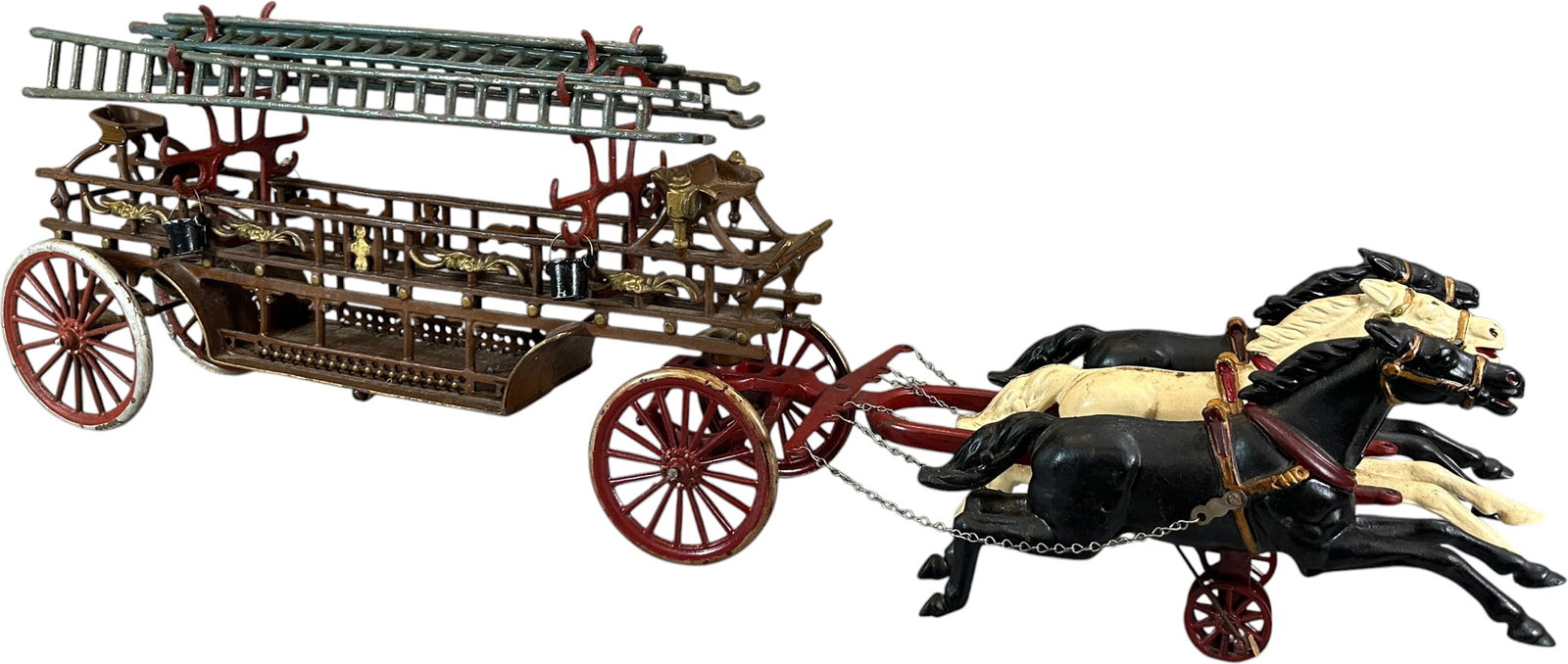 OVERSIZED DENT HOOK AND LADDER WAGON: 458. OVERSIZED DENT HOOK AND LADDER WAGON | 32" l. | Original back end with correct ladders, horses and hitch are restored, (Excellent Condition) | $400 - $800