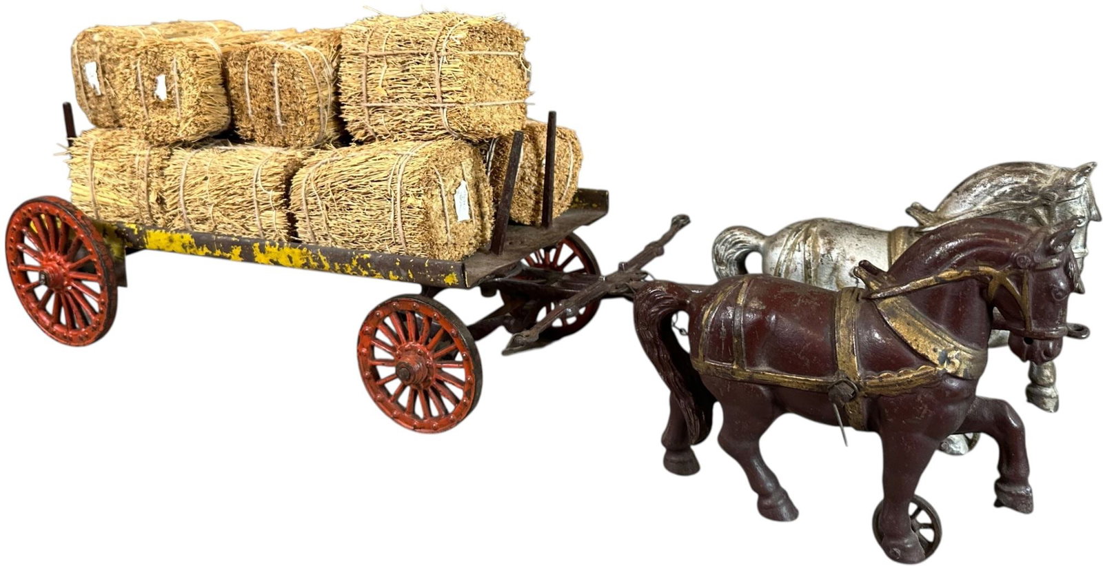 SHIMER HORSE DRAWN STAKE WAGON: 467. SHIMER HORSE DRAWN STAKE WAGON | 21" l. | Two back bars replaced, (Very Good to Excellent Condition) | $300 - $400
