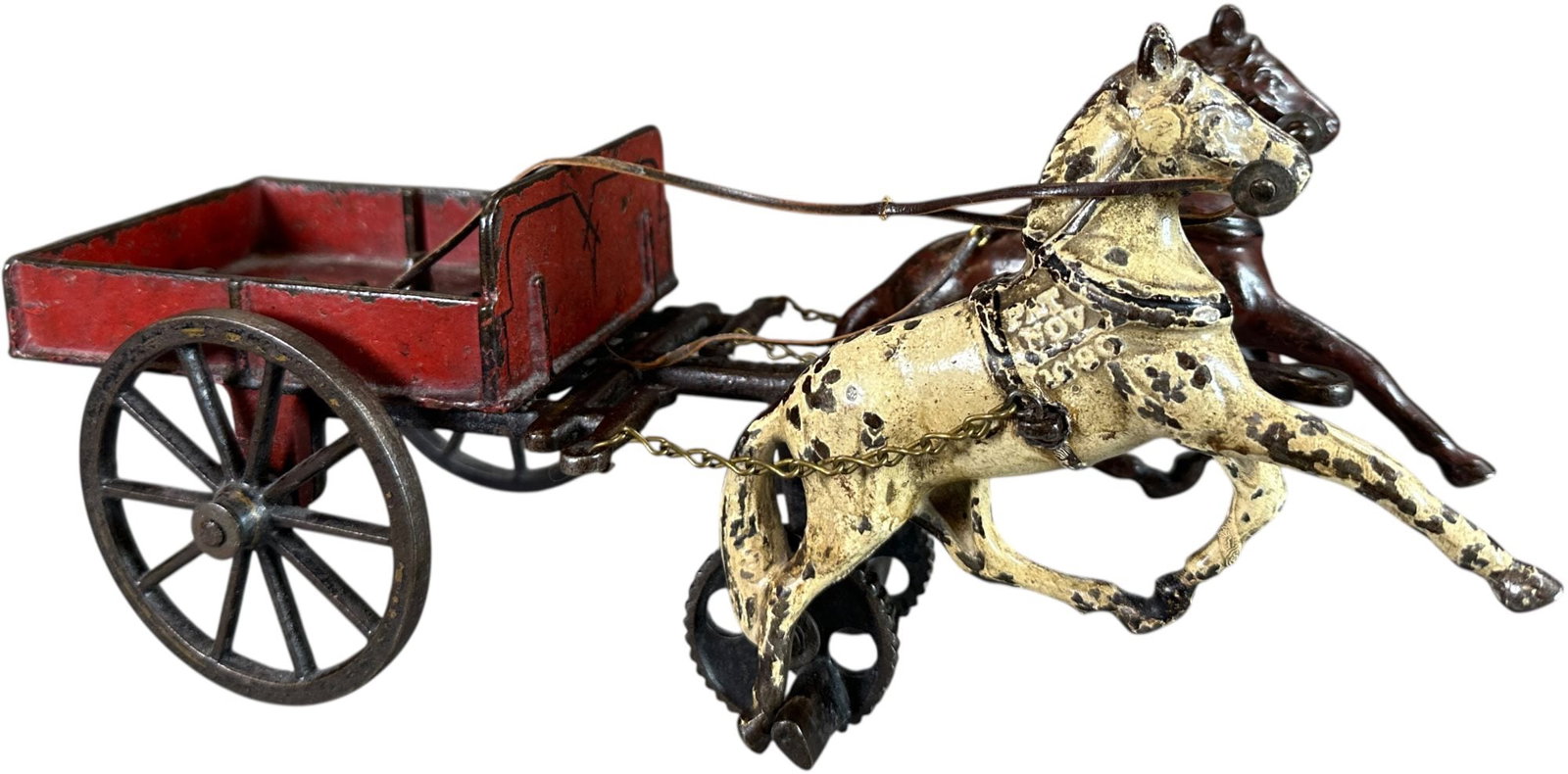 CARPENTER TWO SEAT DEPOT WAGON: 468. CARPENTER TWO SEAT DEPOT WAGON | 12" l. | Other than two small spots on white horse being touched up the toy is all original, missing figures and seat, (Very Good to Excellent Condition) | $200