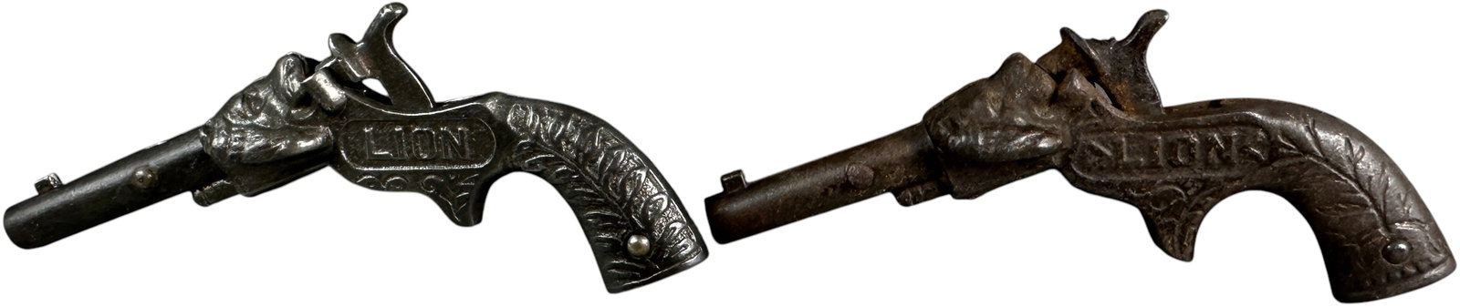 TWO LION CAP GUNS - 2