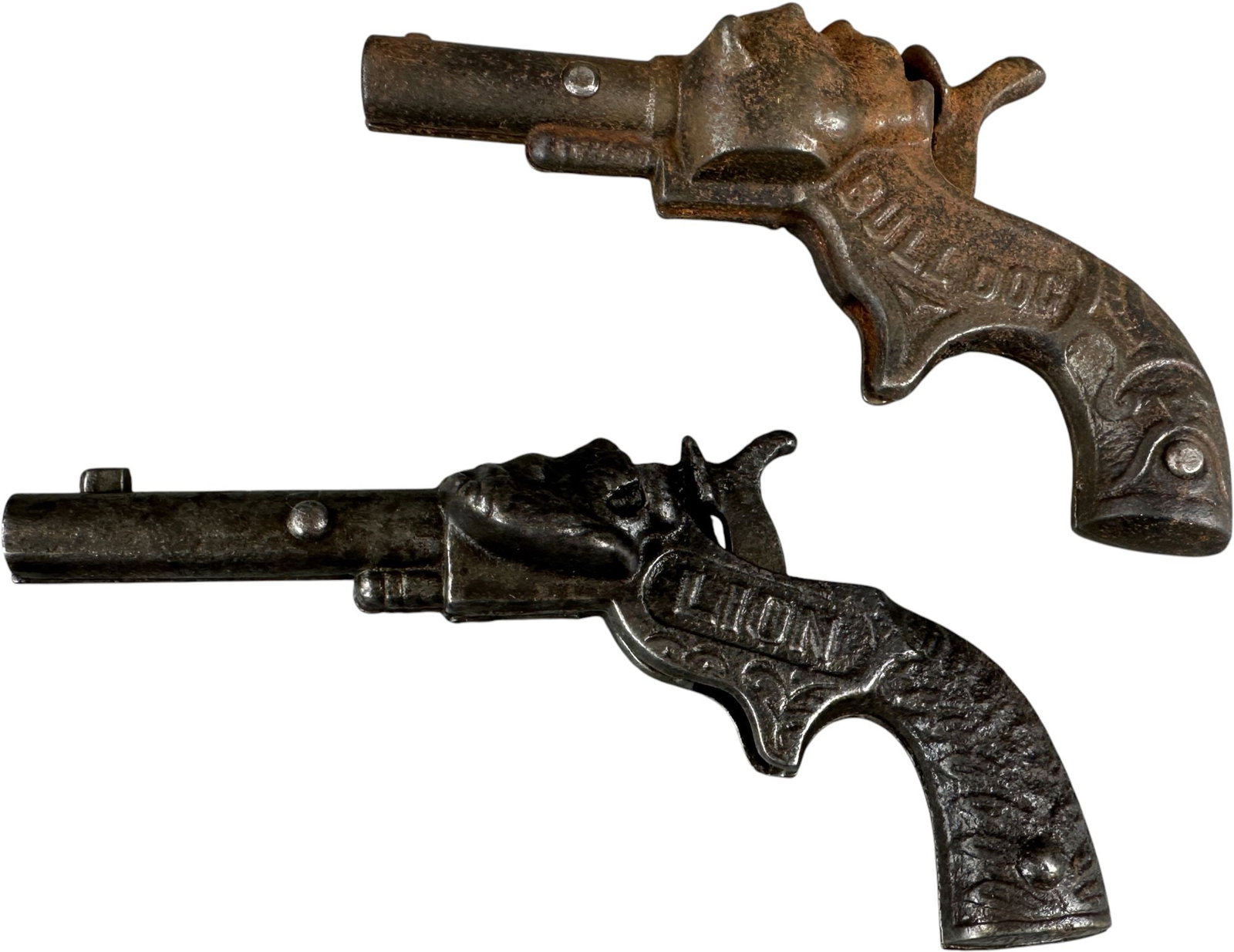 LION AND BULL DOG CAP GUNS: 495. LION AND BULL DOG CAP GUNS | 5.5" l. | (Very Good to Excellent Condition) | $200 - $400