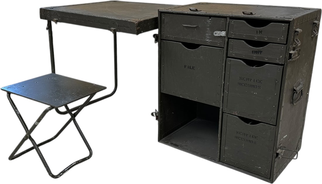 WWII U.S. ARMY FIELD DESK: 395. WWII U.S. ARMY FIELD DESK | World War II U.S. Army portable field desk constructed as a rugged olive-drab metal transit case. Opens to form a desk with folding tubular-steel legs and fitted inter