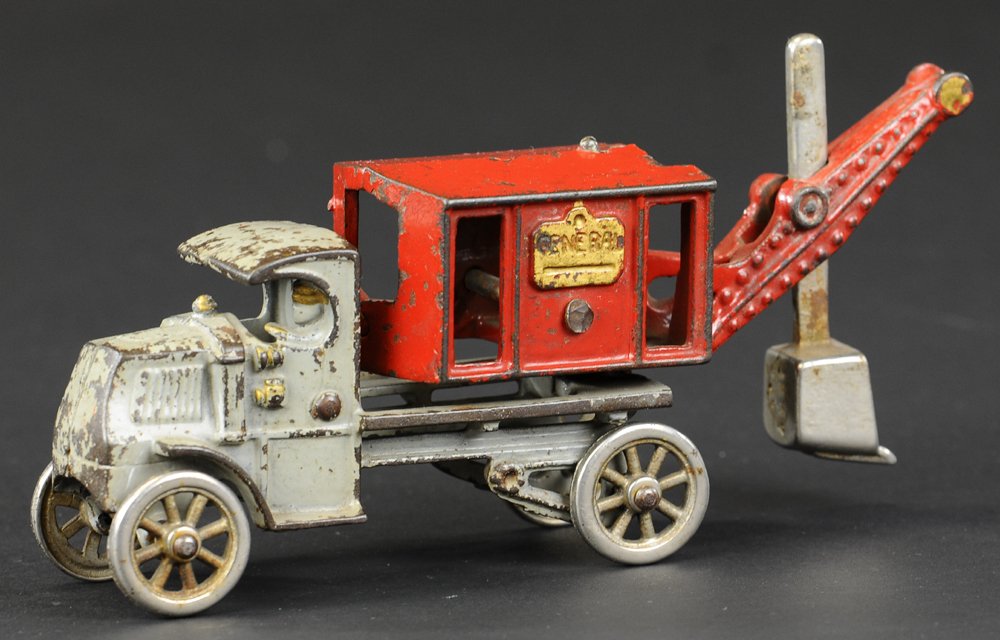 HUBLEY GENERAL DIGGER ON MACK CHASSIS: Smaller early version with nickel plated spoke wheels, cast iron, painted in grey Mack cab with red shovel body, nickel shovel and wheels, integral cast driver and worker stands at body. 8" l.