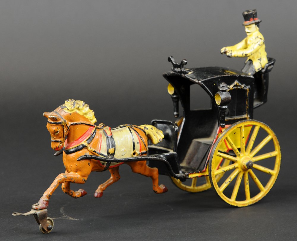 PRATT & LETCHWORTH HANSOM CAB: Cast iron, good detail to paint scheme, yellow and black enclosed cab, seated rear driver, brown horse with white saddle, red trim, yellow lantern interiors. 12" l.