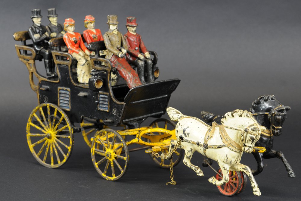 HUBLEY THREE SEAT BRAKE: Cast iron, popular rendition of early leisure time travel, three high mounted seats carry driver and passengers, large spoke wheels allow for easy floor pulling, drawn by team of galloping horses. 18"