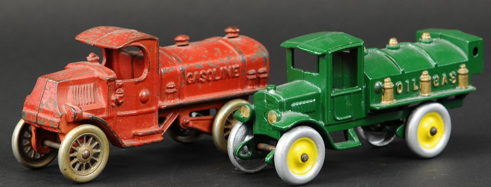 LOT OF TWO GAS TANK TRUCKS: Cast iron, includes green Oil & Gas truck by Kenton and red Mack Gasoline Tank truck with nickel spoke wheels by A.C. Williams. Both 7 1/4" l.