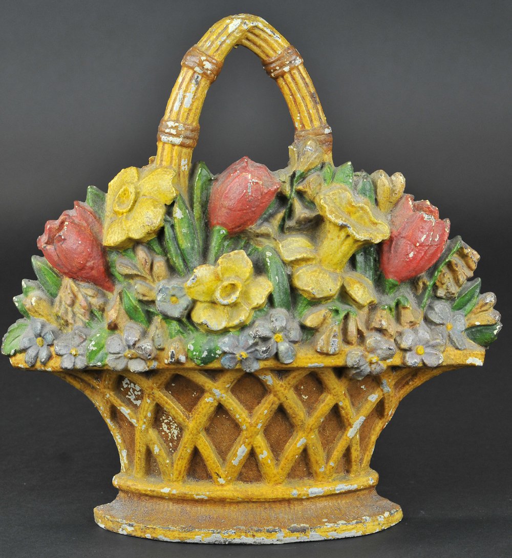 BASKET OF JONQUILS & TULIPS DOORSTOP: Cast iron, beautiful heavy casting of mixed flowers, includes: jonquils, tulips, and violets in deeply embossed woven basket, rare. 11 1/2" h.