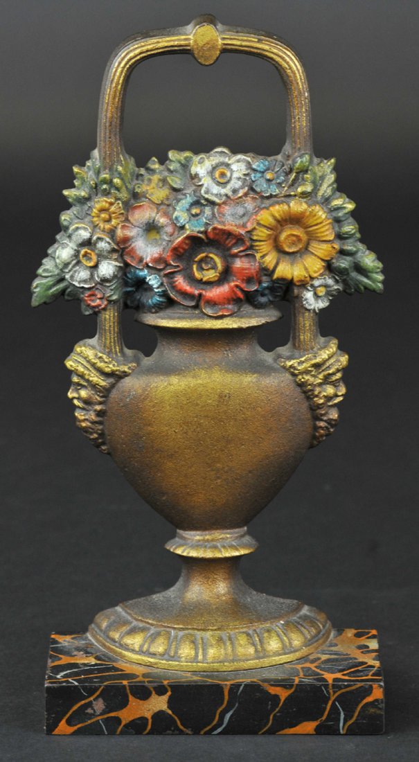 * MIXED FLOWERS IN URN DOORSTOP: B&H, Cat. #369-N, fine detailed cast iron example with handle, gold painted urn vase, displays mixed flowers on marble effect painted base, rubber bumpers intact. 10" h. Ex. Jeanne Bertoia Collection.