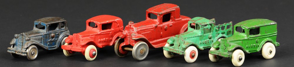 LOT OF FIVE VEHICLES: Cast iron grouping, includes coupes, stake truck, and Austin panel van, varied colors, nickel disc and rubber tire examples. 3 1/8" to 4 1/4" l.