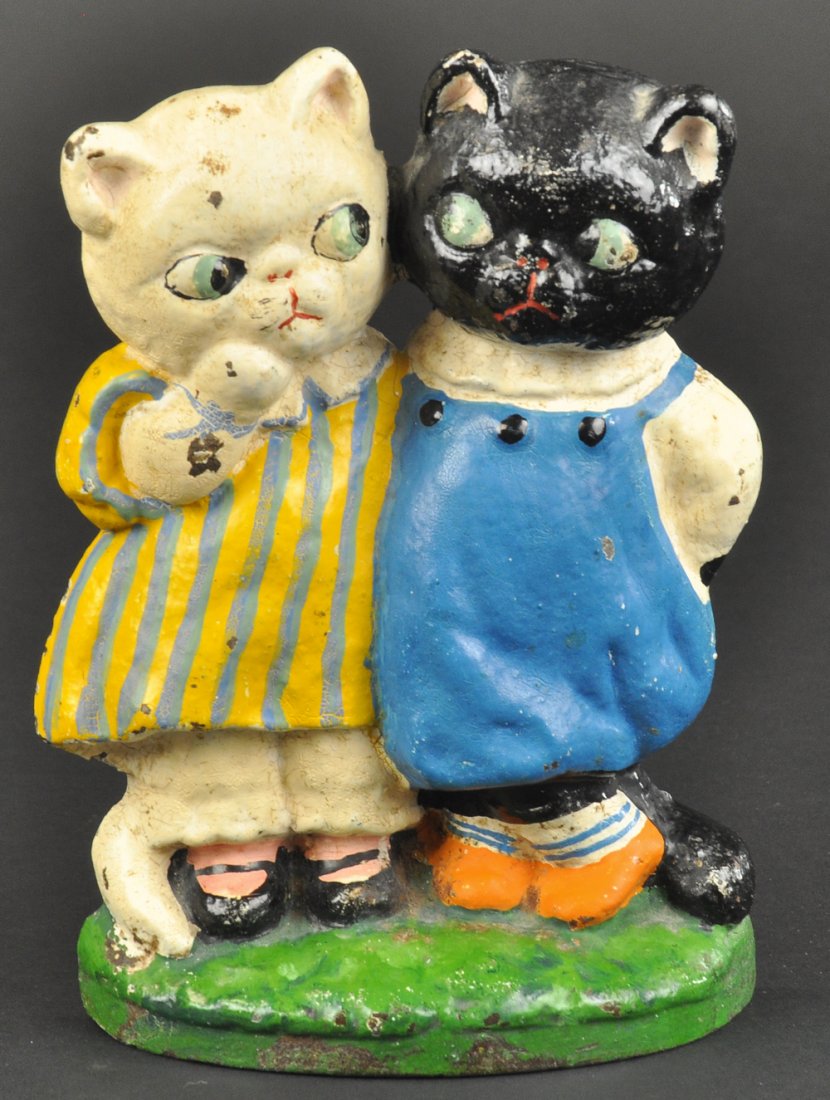 * TWIN KITTENS DOORSTOP: Drayton design, colorful depiction of two sided glancing kittens, one in dress, one in jumper, whimsical piece. 7 1/2" h. Ex. Jeanne Bertoia Collection.