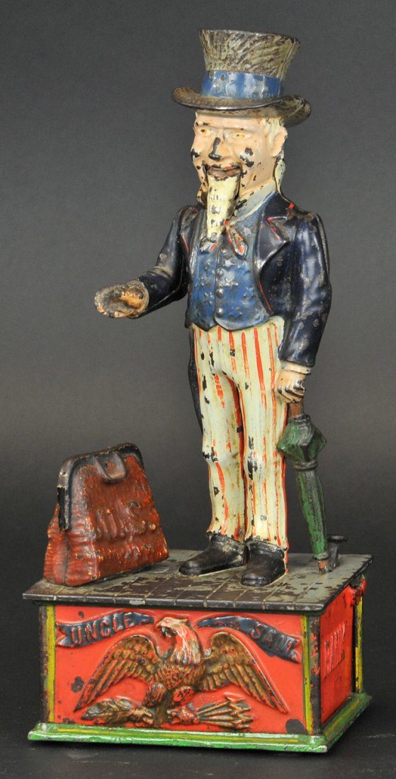UNCLE SAM MECHANICAL BANK: Shepard Hardware Co., designed by Charles Shepard & Peter Adams, patented 6/8/1886. A very comical appearance is given to the face, the lower jaw being balanced on pivots and easily kept in motion. Th