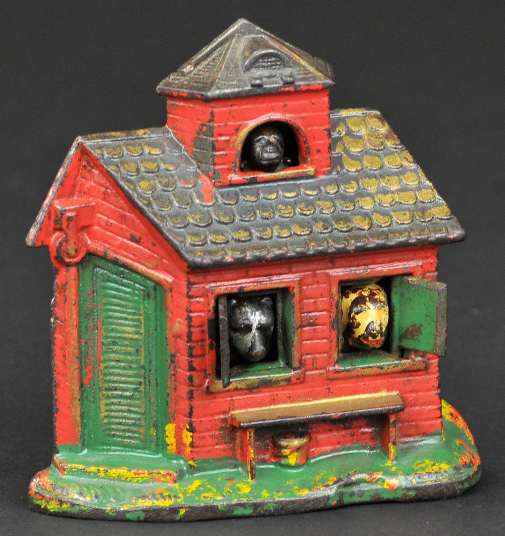 ZOO MECHANICAL BANK: Kyser & Rex Co., circa 1894. This is the cheapest mechanical iron bank on the market. The money is put in the slot & remains in sight until the monkey’s face is pressed, when it falls, the shutters 