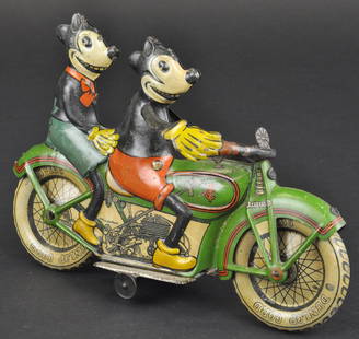 MICKEY AND MINNIE MOUSE RIDING MOTORCYCLE: Tipp & Co., Germany, c. 1930's, lithographed tin, a visually stunning toy, as famed comic pair is depicted astride a motorcycle with working clockwork mechanism; long considered the most sought after