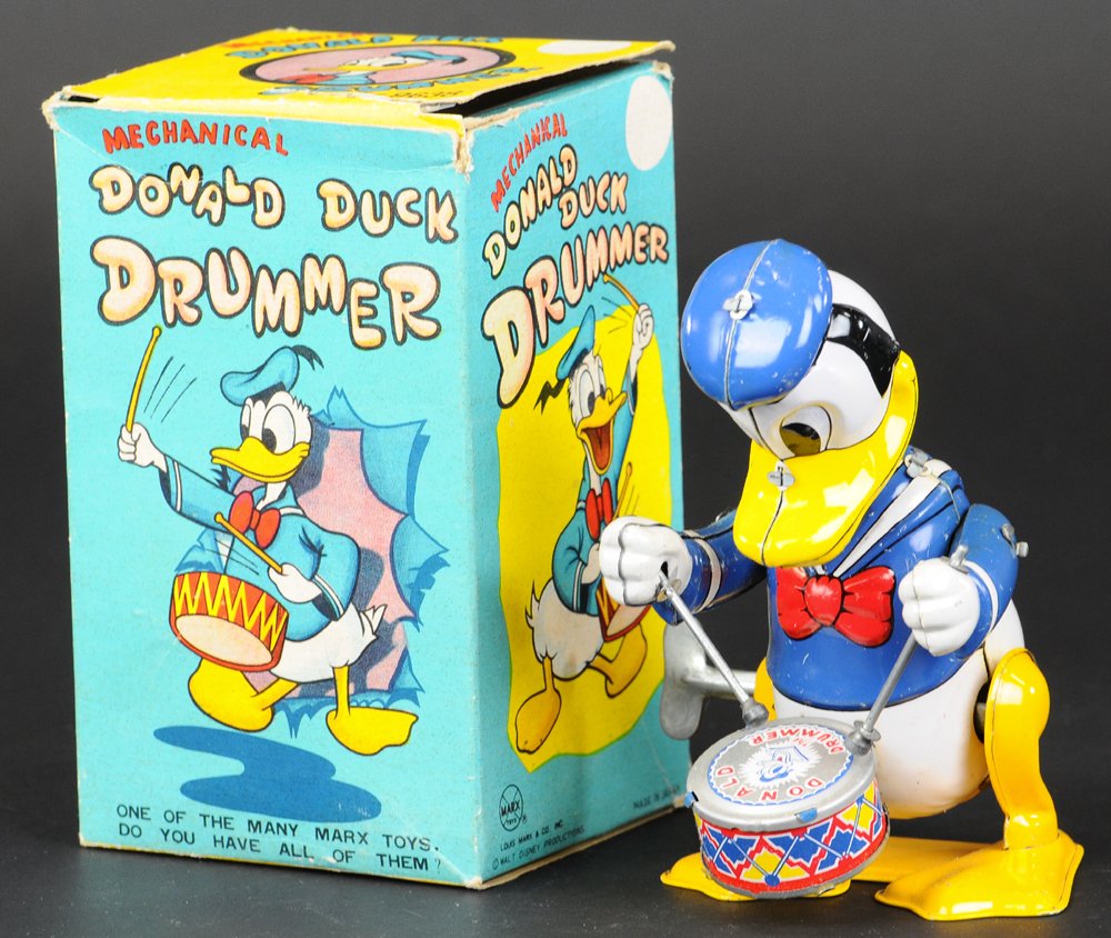 BOXED DONALD DUCK DRUMMER: © Walt Disney Productions, Linemar, Japan, lithographed tin, features Donald with drum at waist, key wind allows drumming motions. 6 1/4" h.