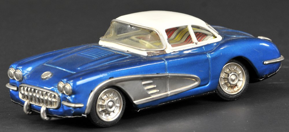 1958 CHEVROLET CORVETTE TWO-DOOR CONVERTIBLE: Yonezawa, Japan, blue body, white roof, wide tin side trim, rubber tires, friction powered. 9 1/2" l.