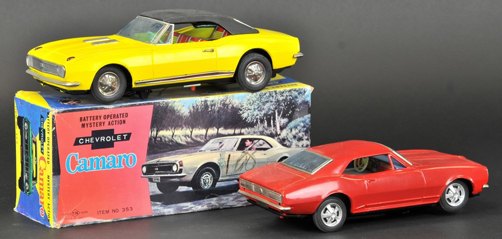 LOT OF TWO 1960'S CAMARO TWO-DOOR HARDTOPS: Japan, includes a boxed yellow 1968, and a red 1967 model, both battery-operated. 9 3/4" to 11" l.