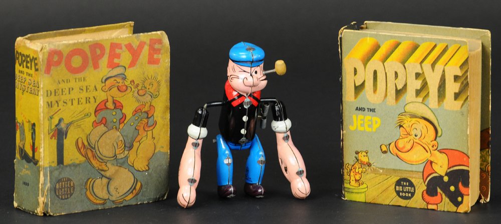 POPEYE TUMBLING WIND-UP AND BOOKS: Linemar, Japan, lithographed tin, depicts Popeye able to tumble about when wound, together with Deep Sea Mystery and The Jeep Big Little Books. 5" h.