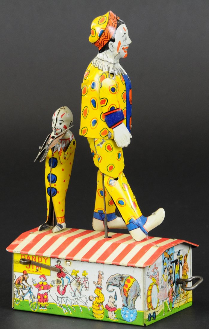 UNIQUE ART "DANDY-JIM" THE JOLLY CLOWN DANCER: Litho tin wind-up toy, Unique Art in the 1920's, clown is accompanied by a much smaller clown playing a fiddle on shared lithographed base. 9 1/2" h.