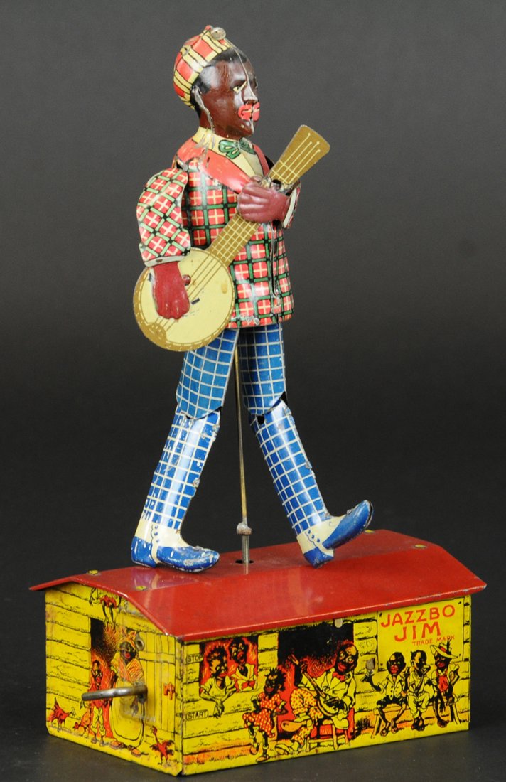 JAZZBO JIM: Ferdinand Strauss Corp., lithographed tin wind-up, colorful graphics surround log cabin used as stage for Jazzbo Jim, billed as the dancer on the roof, key wind operated. 10 1/4" l.