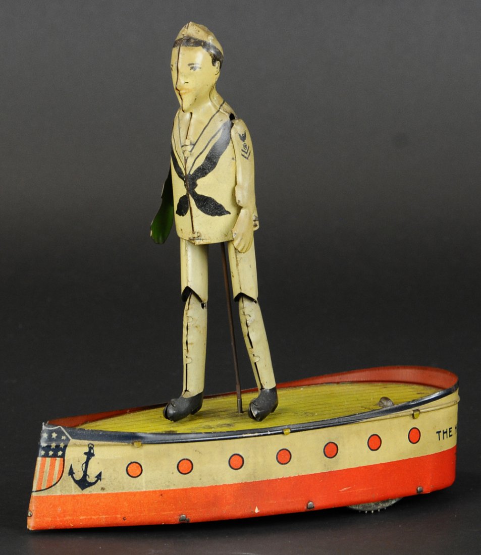 JACKIE THE HORNPIPE DANCER: Ferdinand Strauss, lithographed tin, depicts dancing sailor figure on deck of boat shaped base, clockwork driven. 8 1/2" l.