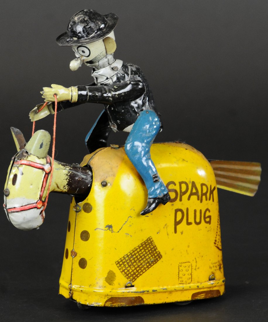 BARNEY GOOGLE RIDING SPARKPLUG: Fischer, Germany, lithographed tin, familiar comic pair depicted in riding toy with clockwork action, creating very aggressive galloping motion, rear of jacket is factory hand painted. 7" l.