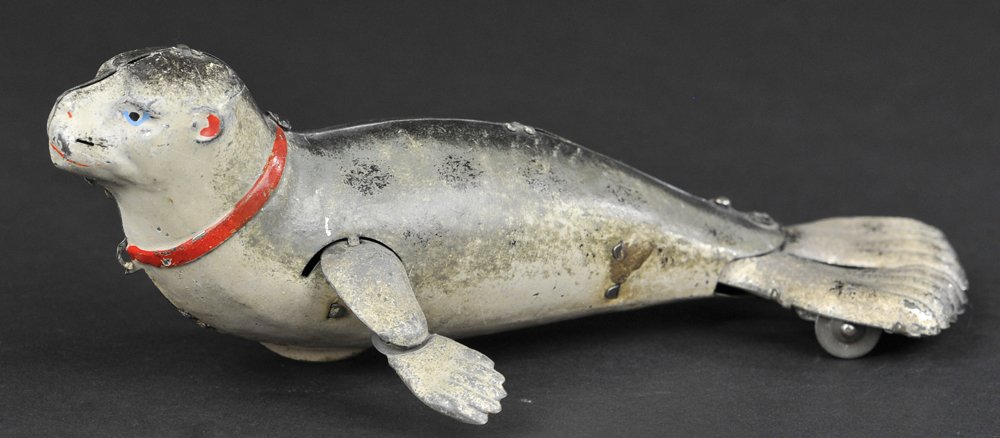 LEHMANN SEAL: Germany, lithographed tin, life-like colors and scale, wind up action, a very popular toy. 7" l.