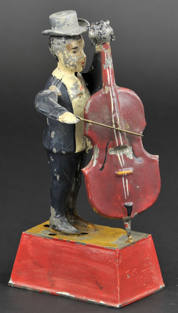 MAN PLAYING BASS GUITAR: Germany, Gunthermann, whimsical depiction of standing figure holding bass and bow in hand, able to emit sound when clockwork is activated, great action. 10" h.