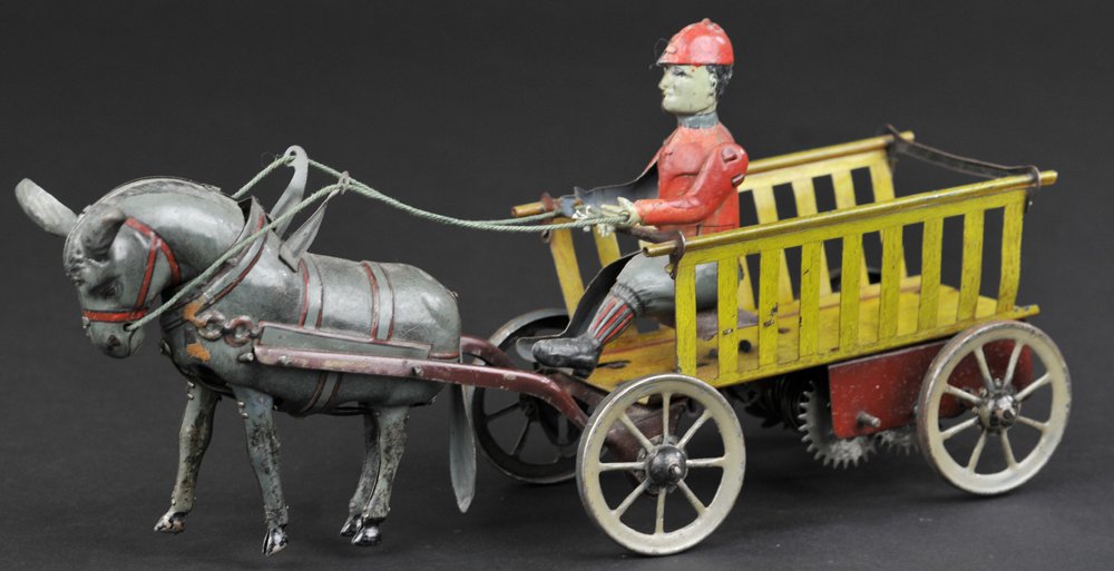 BOY IN FARM WAGON: Hans Eberl, Germany, Tripp Trapp donkey on drawn cart, clockwork driven, lithographed tin, well detailed toy. 11" l.