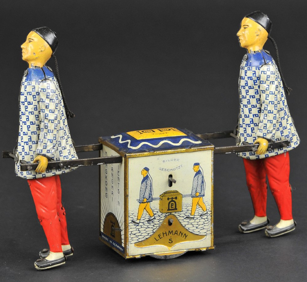 LEHMANN KADI: Germany lithographed tin, depicts two Chinese men carrying box of Peking Tea, flywheel driven, quite natural walking motions. 7 1/2'' long.