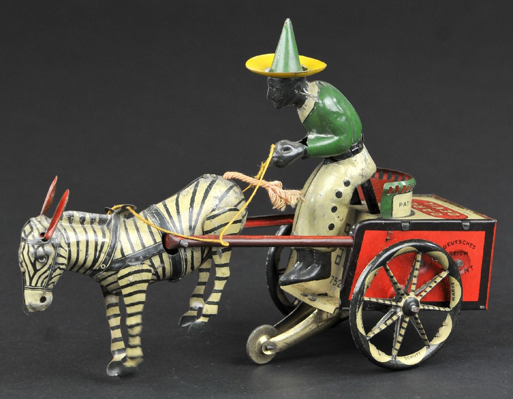 LEHMANN DARE DEVIL: Germany, cart with driver pulled by kicking zebra, litho tin, this toy showed zebras could not be domesticated. 7" l.