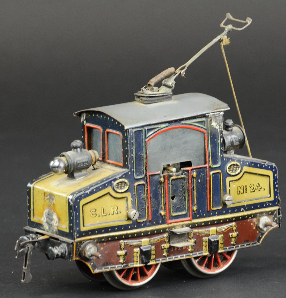 BING STEEPLE CAR: Lithographed tin body, 0-4-0 electric powered and pole attached to roof, lights at each end, reverse and forward action. 6" l.