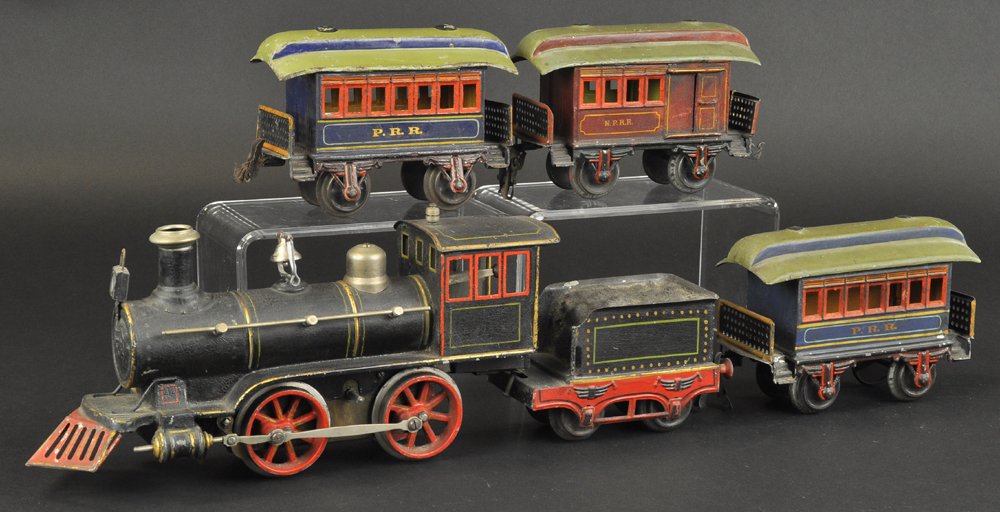 MARKLIN '1' GAUGE LOCOMOTIVE PASSENGER SET: Germany, includes an 0-4-0 electric steam outline locomotive with tender, early hand enameled example with brake, boiler in black w/red trim windows, and tender done in black, green and gold trim; tog