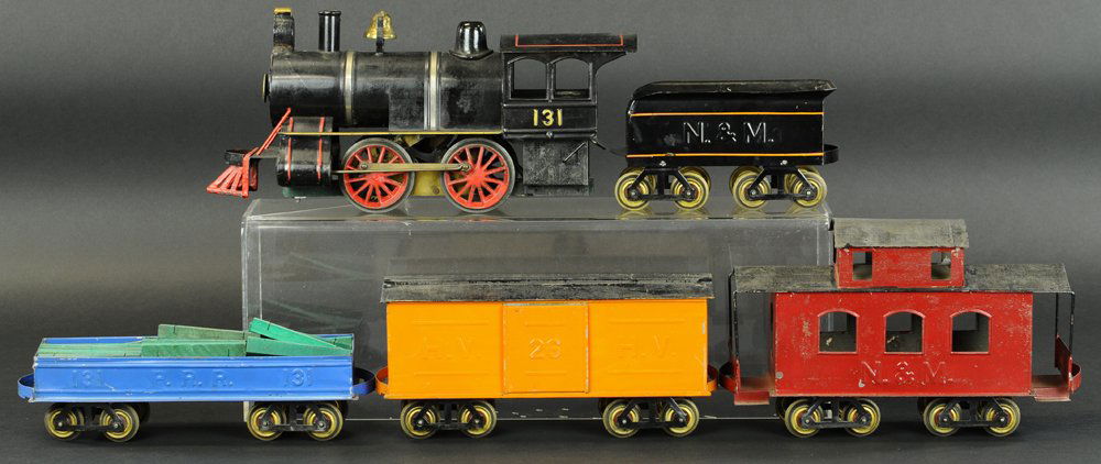 CARLISLE & FINCH FREIGHT TRAIN: Includes electric steam profile #131 locomotive and N. & M. tender, along with 26 H.V. orange Box car, #131 blue P.R.R. Gondola, and maroon N. & M. Caboose, also includes quantity of rail and wood tie