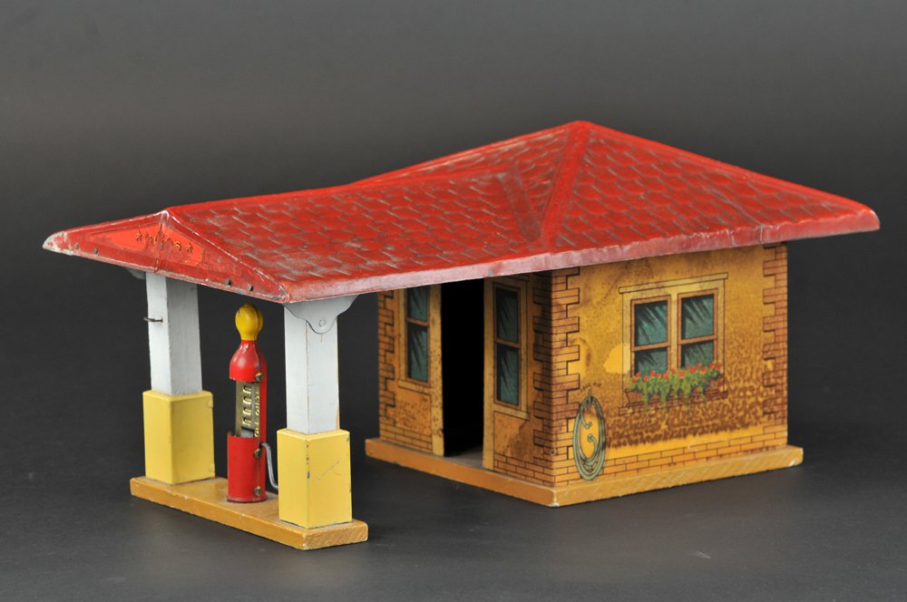 GIBBS SERVICE STATION: Paper over tin service station, features building and fuel pump under drive-thru, canopy covered, embossed roof. 15" l.