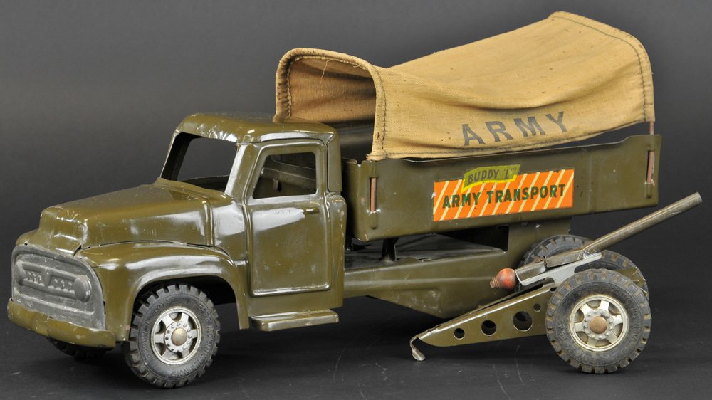 BUDDY 'L' ARMY TRANSPORT: Pressed steel Army truck with canopy cover and gun Howitzer on hitch frame, all painted in olive, rubber tires. Truck 17" l. Gun 9 3/4" l.