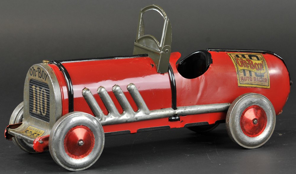 BOAT-TAIL RACER 'OH BOY': c. 1926, Kiddies Metal Toys Co., pressed steel, done in red overall, exposed exhaust pipes, single driver seat, folding windshield, metal disc wheels. 19" l.