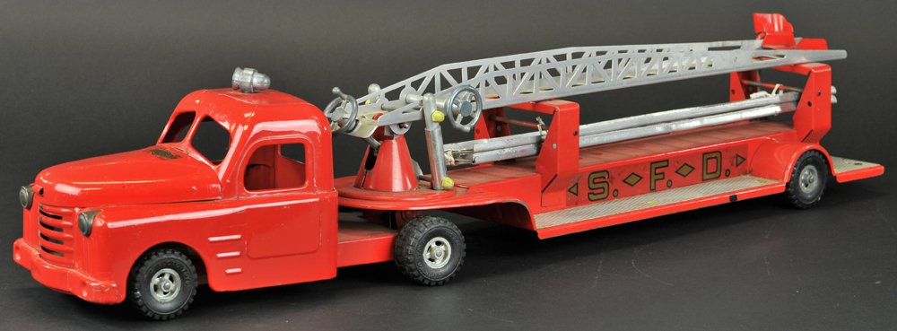 STRUCTO LADDER TRUCK: 1950's, pressed steel, painted in red overall, nickel plated body runners, decals on sides, features long extension ladder on swivel base. 32 1/2" l.