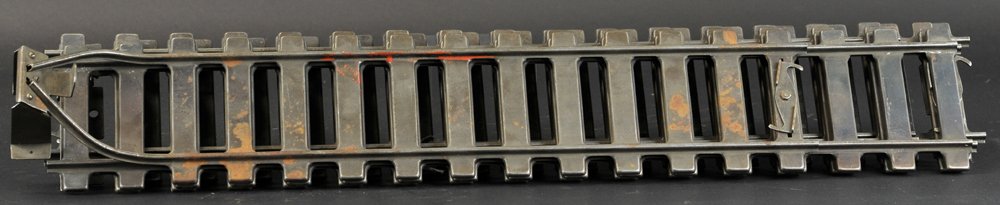 BUDDY 'L' PROTOTYPE TWO FOOT TRACK SECTIONS: c. 1929, lot features five straight track sections and one track piece with built-in bumper, reportedly the first models of pressed steel track to be used for outdoor railroad. 24" l.