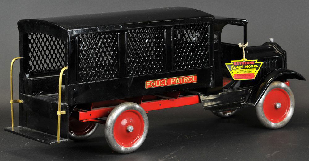 KEYSTONE PACKARD PATROL TRUCK: c. 1926, full cab painted in black overall with three panel screen side service body, rear step with brass handrails, aluminum wheel version with red painted centers. 27" l.