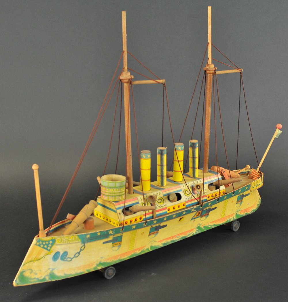 'COLUMBIA' BATTLESHIP: Bliss, paper litho over cardboard, extensive details to upper deck, features four stacks, fully re-rigged, wood guns at all sides, flag nest at bow and stern, two tall masts, and circular fortress at