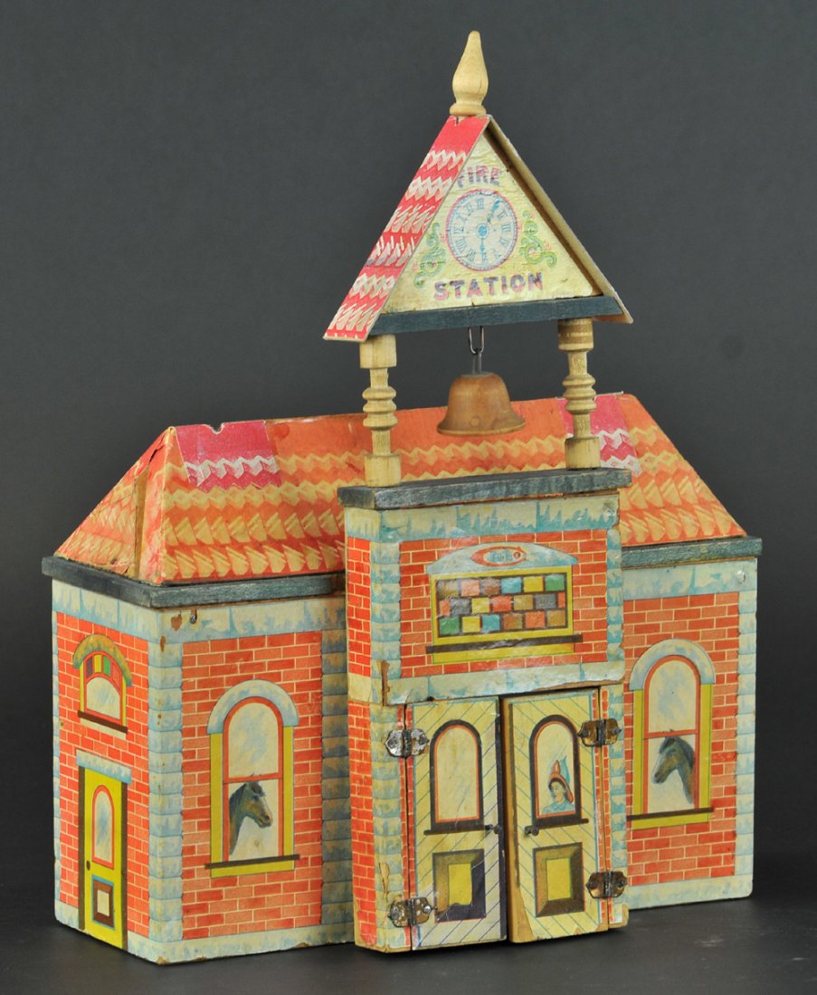 BLISS FIRE STATION: A rare lithographed paper on wood fire station featuring a bell tower and double doors with nicely detailed façade containing pillars and wooden painted bell, c. 1890. 12" h. x 10" w.