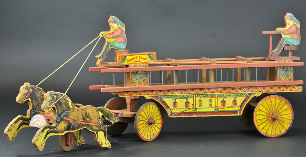 ROUGH & READY LADDER WAGON: Bliss, early paper over wood hook and ladder wagon complete with two seated firemen, and two wood ladders, drawn by two horses, very detailed. 30" overall length.