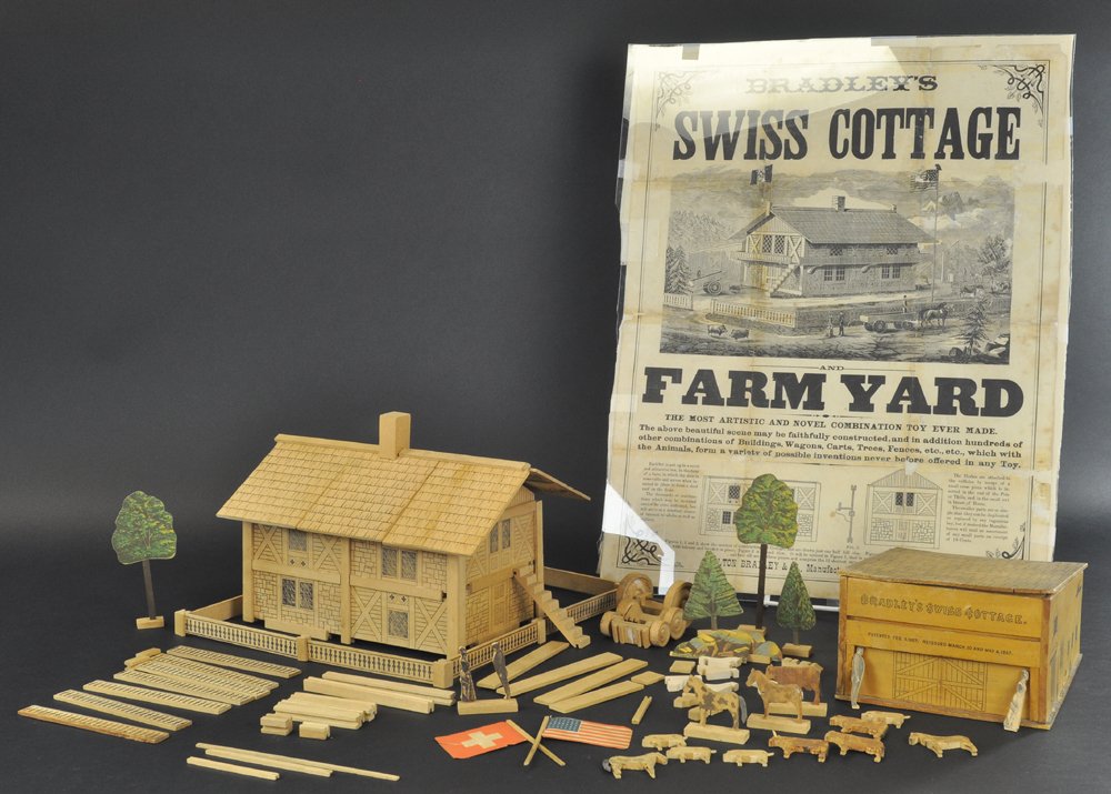 BRADLEY'S SWISS COTTAGE FARM YARD AND BROADSIDE: Boxed early Bradley set, Patented Feb. 5, 1867, consisting of stenciled wood figures and buildings, and paper litho trees and flags, assembles into attractive Swiss style house and barn, comes with or