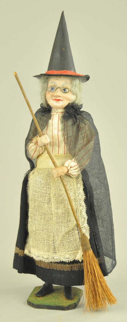 STANDING GERMAN WITCH CANDY CONTAINER: Highly detailed composition and wood with real cloth outfit, face superbly detailed with glasses, holding straw broom, loaded with witchy personality. 14 1/2"-15" h.
