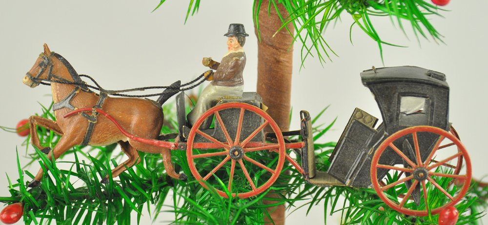 HANSOM CAB DRESDEN ORNAMENT: Pressed cardboard, meticulously handcrafted rendering of a black coach with red spoke wheels drawn by solo horse, complete with driver, great detail inside & out. 6" l. Ex. Tom Fox Collection.