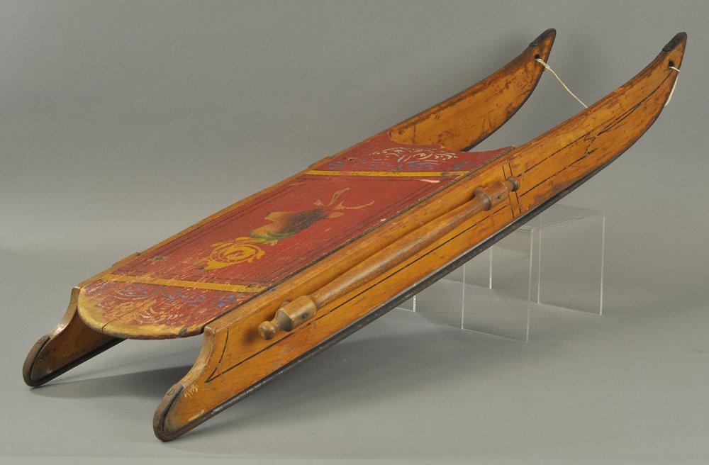 CHILD'S SLED WITH REINDEER: Paint decorated child's wood sled with reindeer head, shows some overall wear but still retains nice original color. 40" l.
