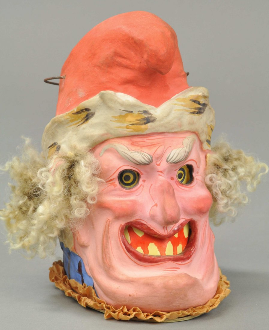 GRINNING SANTA HEAD LANTERN: Germany, exceptional color and detail in this rare piece, red cap with white trim on head, blue collar around base, made of hand painted composition with curly fur-like hair. 6 1/2" l. Ex. Tom Fox Col