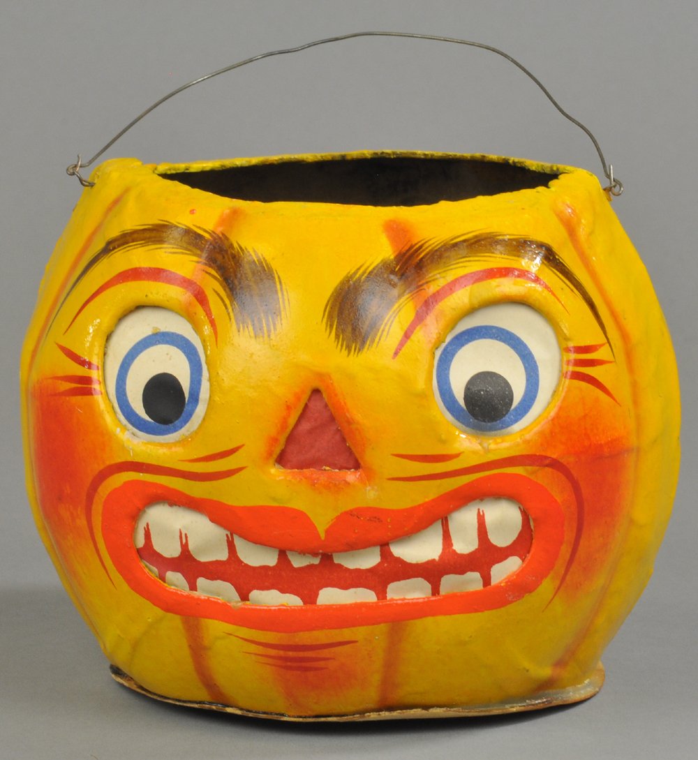 LARGE GERMAN PAPIER MÂCHÉ JACK-O-LANTERN: Extremely rare size German composition papier mâché wash Jack-O-Lantern, highly detailed facial features, great color, original insert, very desirable style in exceptional shape. 5" h. Ex. Tom Fox C