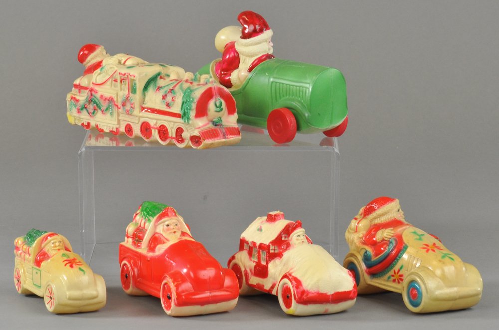 VISCALOID/CELLULOID SANTA AUTOS: Santa Claus themed Viscaloid/celluloid automobiles, all with good color and great detail. 3" to 5" l. Ex. Tom Fox Collection.