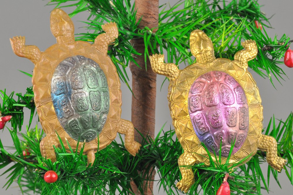 TWO DRESDEN TURTLES: One green shell, one red shell, German Dresden turtle Christmas tree ornaments, both on golden base. 3" each. Ex. Tom Fox Collection.